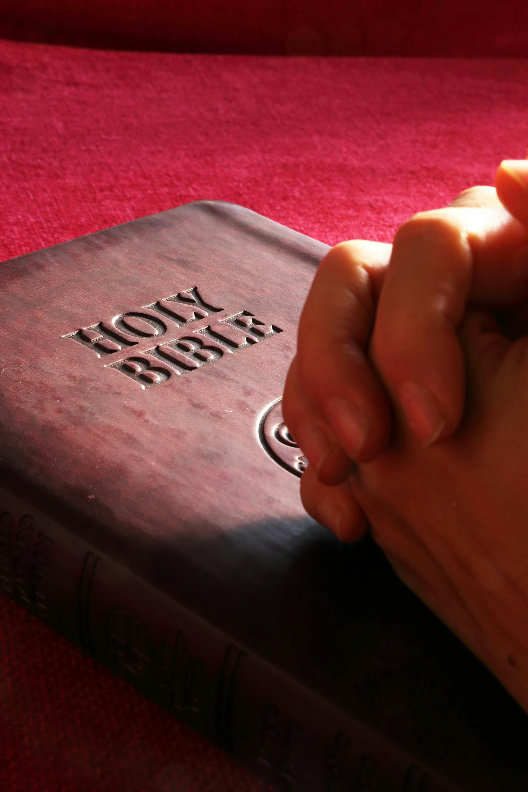 Photo by Pixabay | Motherhues Person Hands on Holy Bible