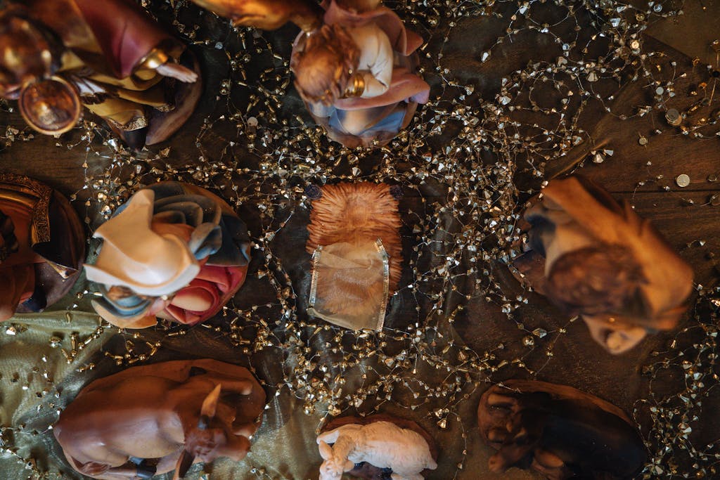 Photo by Douglas Mendes | Motherhues Aerial shot of a nativity scene with various figurines and decorative elements.